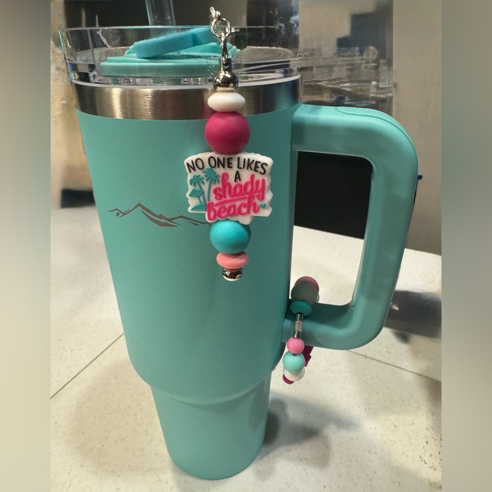 Insulated Turquoise Tumbler with Handle
And 2 charms.